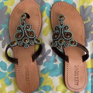 Mystique brown and turquoise sandals.